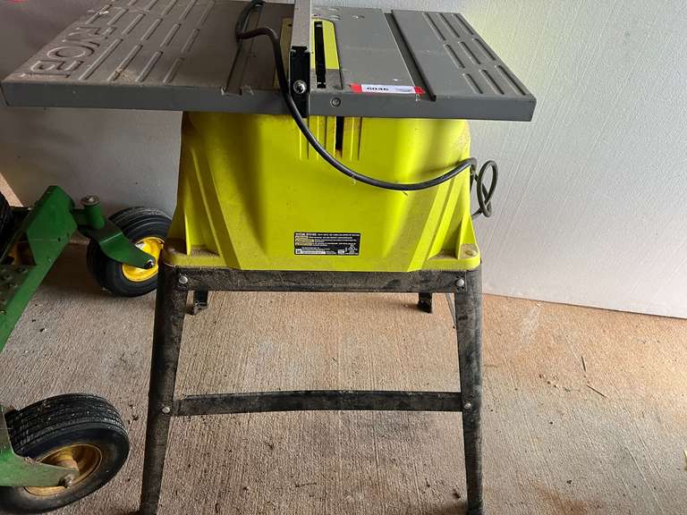 Ryobi 10” table saw with stand, powers up, see pictures for details. image