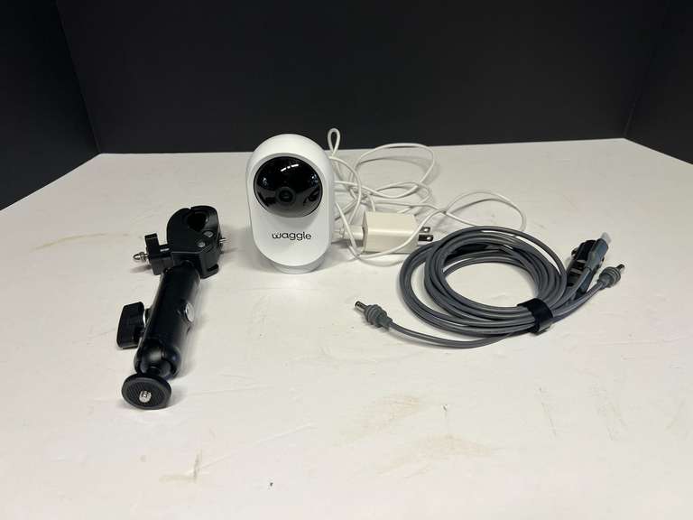 Waggle camera with charging cord and more. Working condition unknown, see pictures for details. image