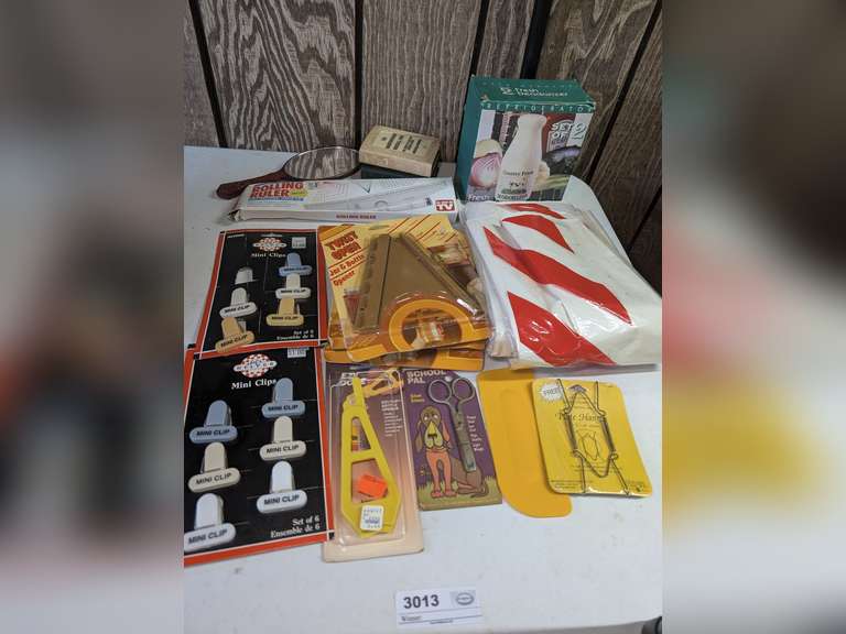 VINTAGE LOT INCLUDING MINI CLIPS, ROLLING RULER, MID-CENTURY BOOK MOTIF BANKS, TWIST OPEN JAR AND BOTTLE OPENERS, WRAPPING TISSUE, AND MORE image