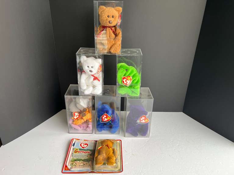 Beanie baby assortment, comes with seven display cases, see pictures for details. image
