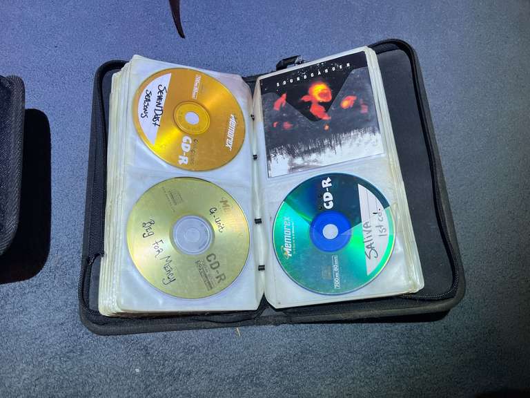 BR2…Storage case of assorted CDs, also includes an empty CD storage case, see pictures for details. image