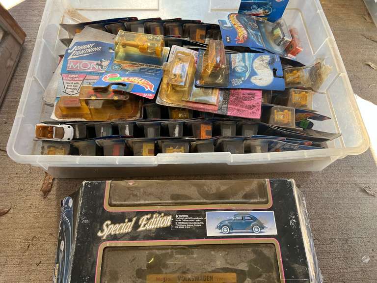 Tub of assorted Hot Wheels cars, and more still new in the package, see pictures for details. image