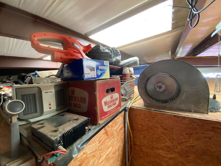 Mystery upper level loft marked 5043, some items include a blower fan, trailer hitch, Patton heater, Black & Decker hedge trimmer, winch, inverter inverter, camp chair, and much more. See pictures for details. ￼ image