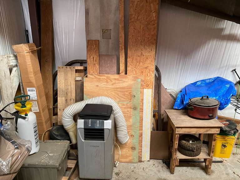 Large group lot of assorted items to include seven dust, plant food, soil builder, sprayer, assorted wood scraps, old metal bed headboard and footboard, Hamilton Beach crockpot, and much more. See pictures for details. image