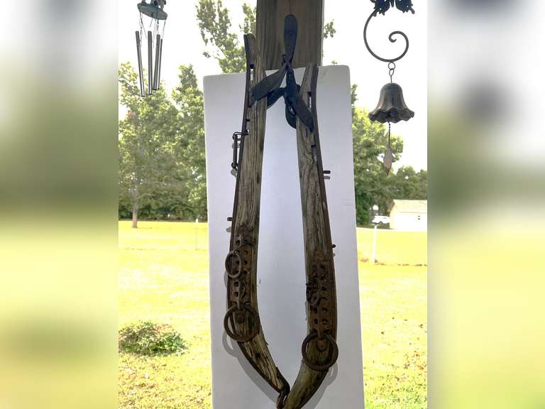 Set of two hames , also includes thermometer and two wind chimes hanging on the same pole image
