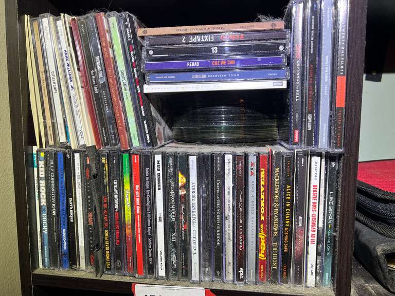 BR2…Large assortment of empty CD/DVD cases, also includes a large stack of CDs/DVDs, not sure if they all match the empty cases, see pictures for details. image