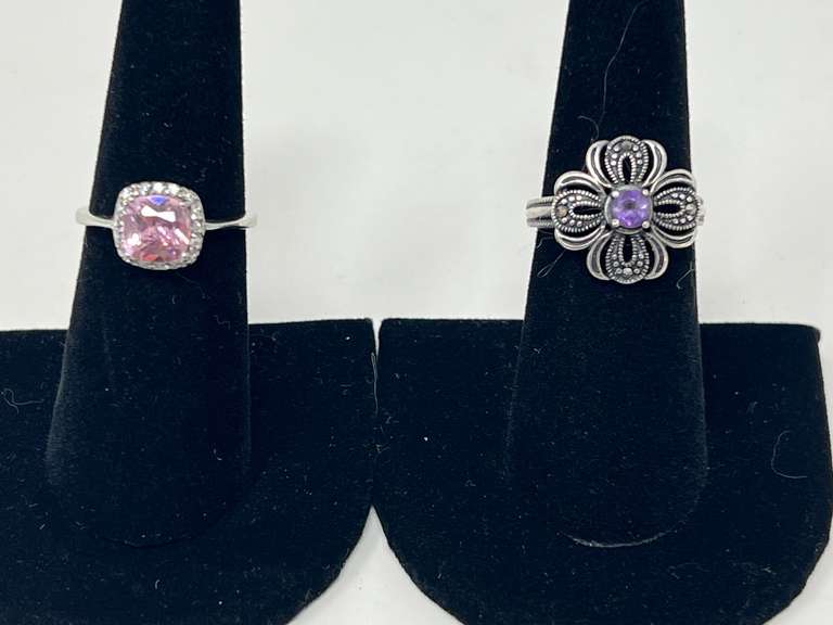 Ladies silver rings, both pieces are stamped 925 to include a purple amethyst colored flower ring, and one with a pink stone that resembles pink topaz, see pictures for details. image