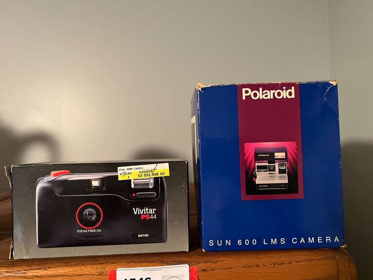 BR3… Vivitar PS4 camera, and Polaroid Sun 600 LMS camera, both pieces come in original boxes, see pictures for details. image