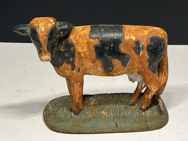 Cast metal cow doorstop, see pictures for details. image