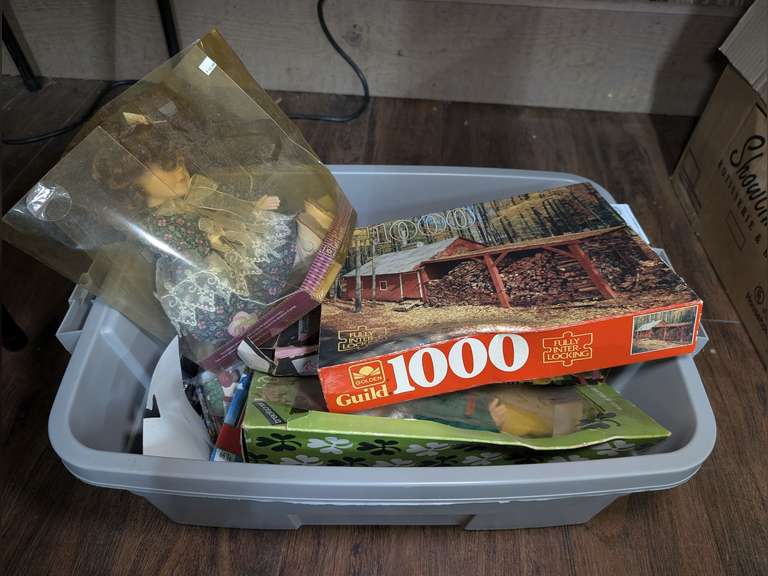 TUB FILLED WITH DOLLS, PUZZLE, AND MORE image