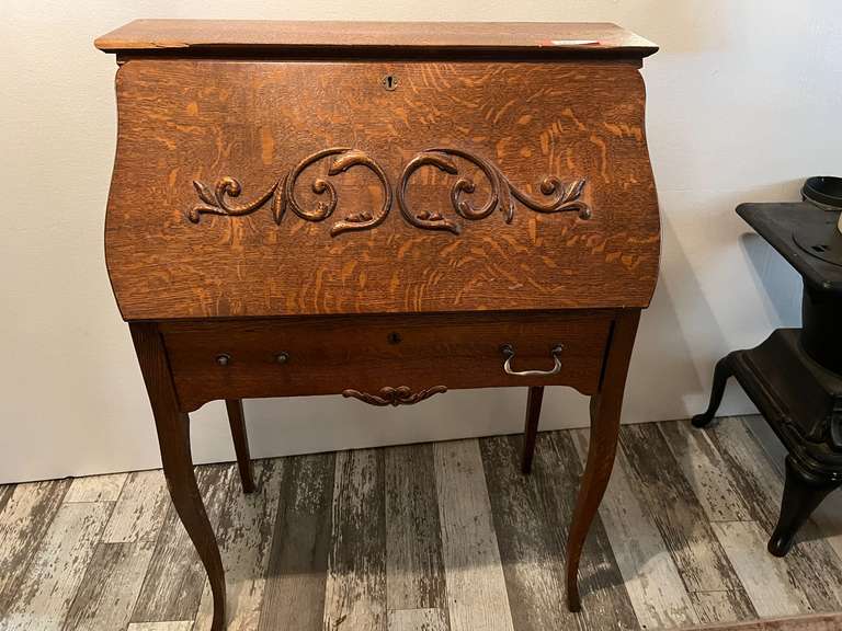 DEN…Antique Oak Larkin secretary with slant front, one drawer handle is missing, comes with antique oak spindle back chair, it appears the leather has been replaced in the seat, see pictures for details. image