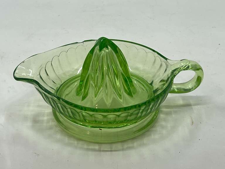 LR… Vintage/antique green uranium glass juicer, the rim has some chipping present, see pictures for details. image