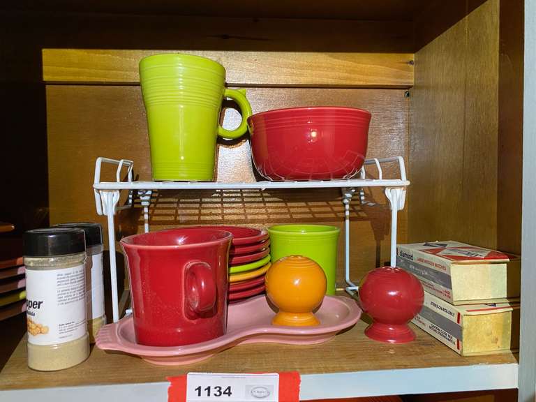 KIT… Shelf lot marked 1134, to include assorted Fiestaware berry bowls, bowl, cups, salt and pepper shaker, and more. See pictures for details. image