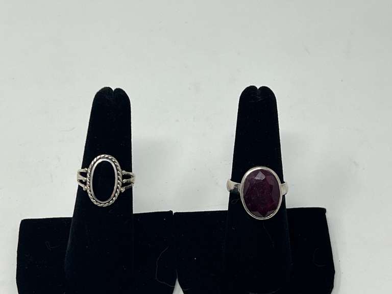Sterling silver rings, two pieces, both pieces are stamped 925, includes one with a faceted ruby colored stone, and one, believed to be onyx with a rope twist bezel, see pictures for details. image