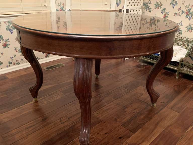 ANTIQUE HEAVY ROUND DINETTE TABLE WITH BUILT IN LEAF ON ROLLERS WITH GLASS TOP 48" ROUND X 30" TALL - DINETTE image