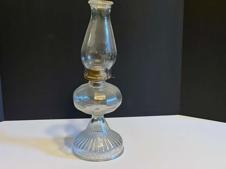LR… Vintage oil lamp with fluted base and glass chimney, see pictures for details. image