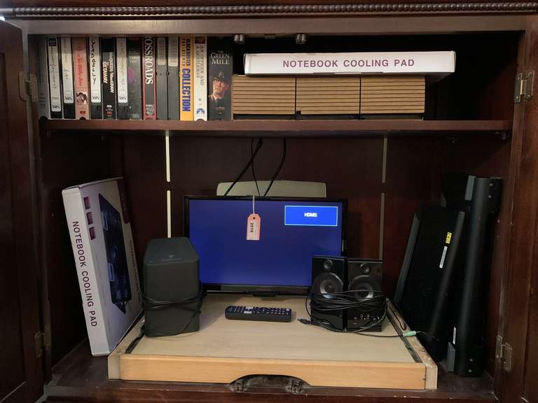 CABINET LOT TO INCLUDE VHS MOVIES, CASSETTES, 2 NEW NOTEBOOK COOLING PADS, 18" INSIGNIA TV & MORE - UP MASTER BED image