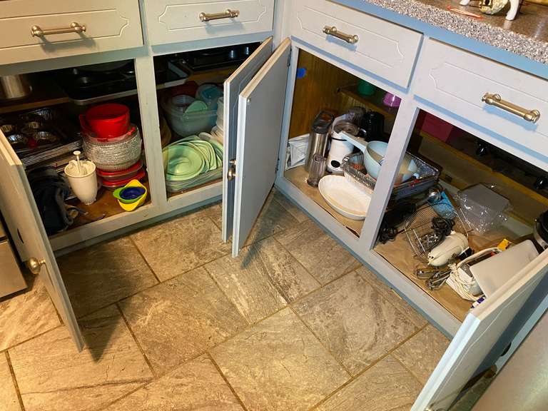 KIT… Lower kitchen cabinet and drawer lot marked 1160, includes all content of cabinets and drawers from edge of stove to edge of refrigerator, items include assorted storage containers, Fry Daddy, vintage mixer, Griddler panini/sandwich press, and more. See pictures for details. image