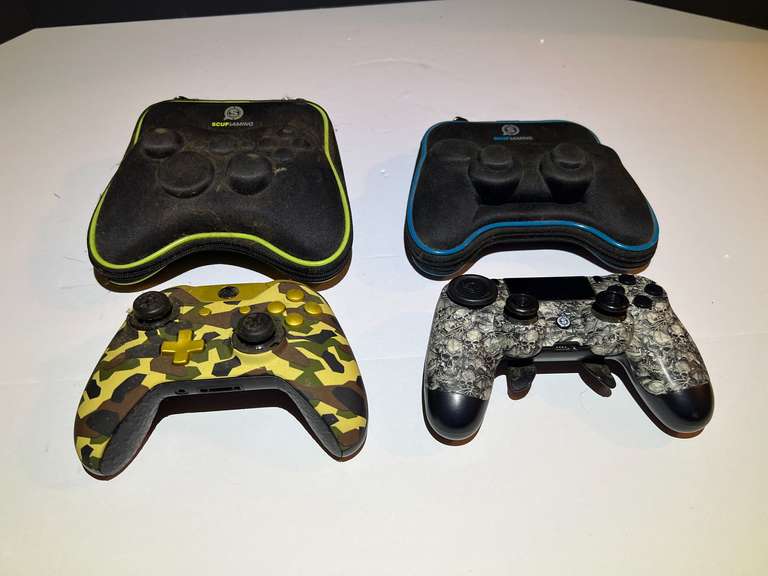 BR1…Gaming controllers, two pieces, both come in protective storage cases, see pictures for details. image