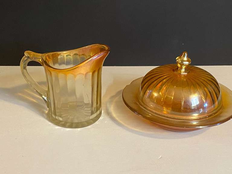 LR… Vintage panel carnival glass creamer, also includes a ribbed vintage glass butter dish with lid believed to be vintage Imperial glass Marigold Carnival glass, there is some chipping on the lid rim and dish rim, see pictures for details. image