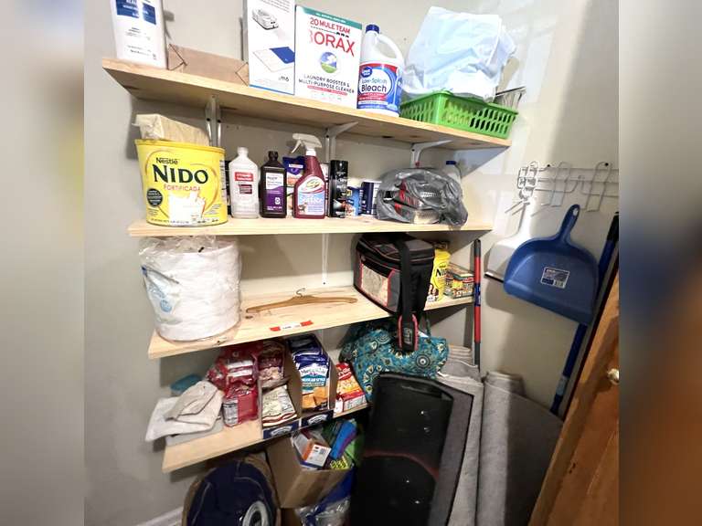Laundry… Shelf lot marked 1436, includes all contents of  four shelves as well as items on floor underneath and utility rack on the wall. Items include assorted cleaning products, woven basket, area rugs, broom, dust mop, and much more. See pictures for details image