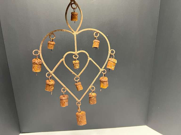 Metal heart shaped wind chimes with bells, rust is present, see pictures for details. image