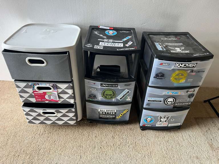 Rolling three drawer carts, two Sterilite with content, and one Home Logic. One of the Sterilite drawers is missing, see pictures for details. image