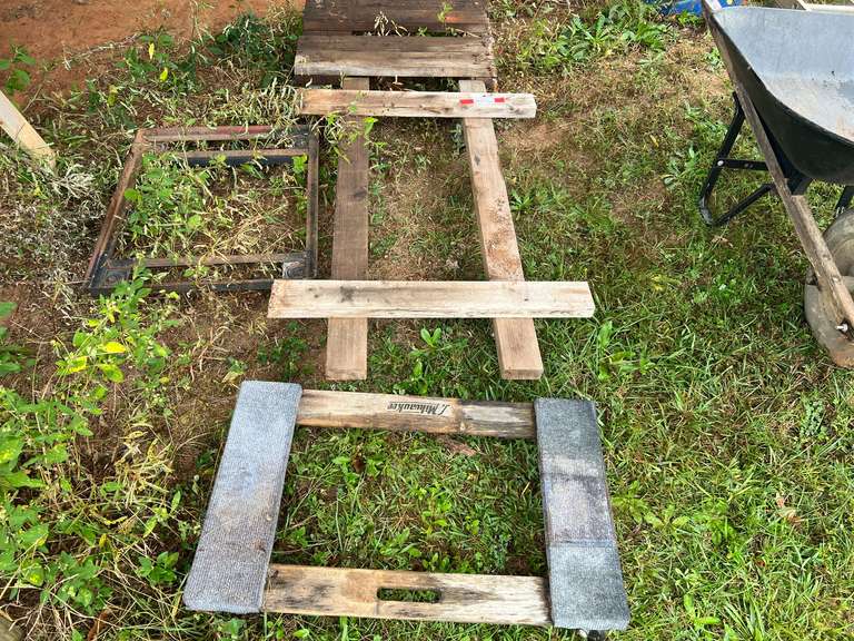 Set of four rolling dollies. Some appear to be homemade image