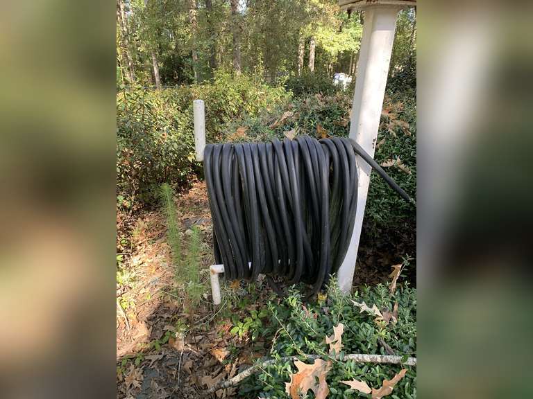 2 EXTRA LONG BLACK GARDEN HOSES (ONE BY BIRD FEEDER & ONE IN YARD) - FRONT YARD image