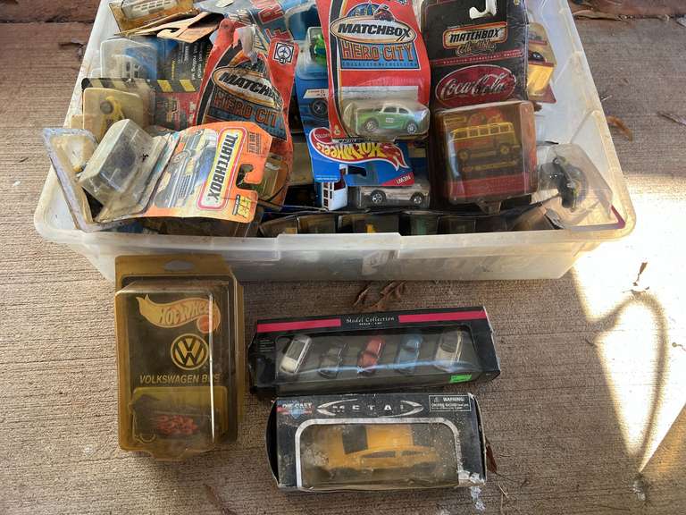Tub of assorted Hot Wheels, Matchbox cars, and more, still new in the package, see pictures for details. image