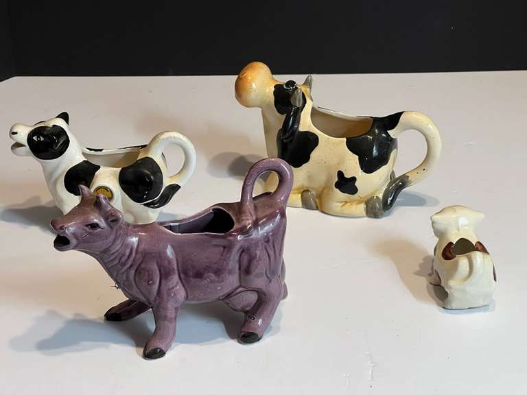 LR… Ceramic cow creamers and decor, four pieces, see pictures for details. image