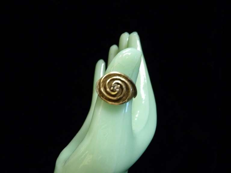 14 KARAT GOLD SWIRL RING WITH SMALL DIAMOND IN MIDDLE SIZE 8 1/2 WEIGHING APPROXIMATELY 7.6 G image