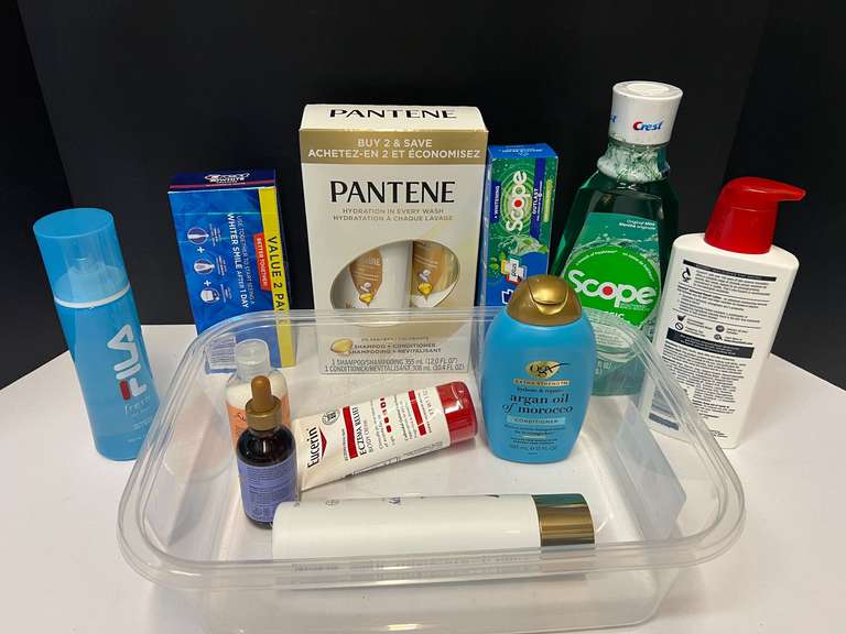 Assortment of toiletries to include shampoo, toothpaste, mouthwash, and more. Tub is not included, see pictures or details. image