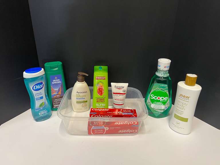 Assorted toiletries to include shampoo, body wash, mouthwash, body cream, and more. Tub is not included, see pictures for details. image