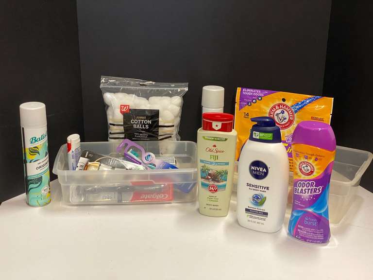 Shelf lot marked 6119 of assorted toiletries to include body wash, dry shampoo, toothpaste, toothbrush, deodorant, and more. Tubs are not included, see pictures for details. ￼ image