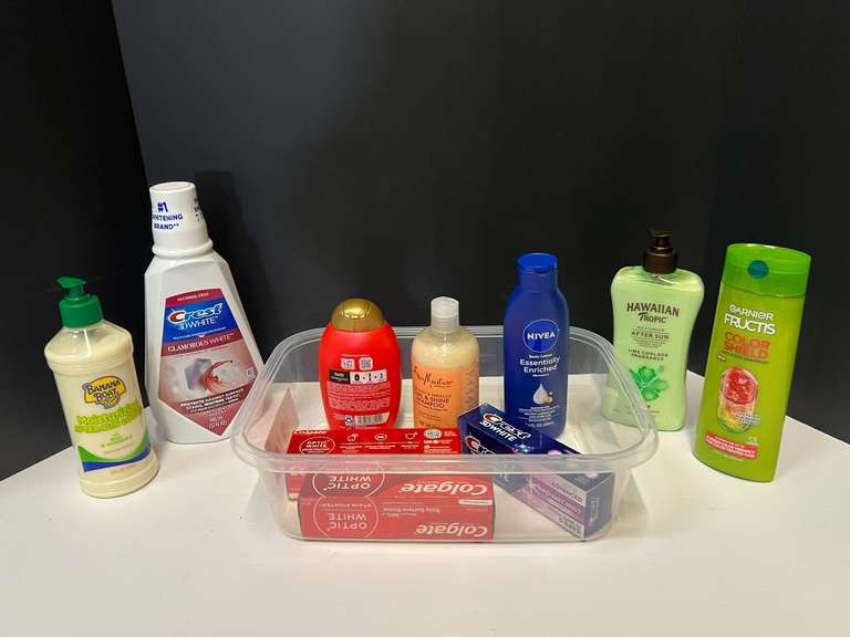 Toiletry assortment to include shampoo, moisturizer, toothpaste, mouthwash, and Moore. Tub is not included, see pictures for details. image