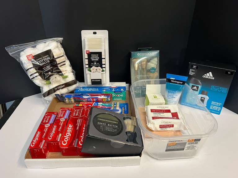 Assorted toiletries to include cotton swabs, makeup brushes, Adidas men’s fragrance set, toothpaste, and more. Tub is not included, see pictures for details. ￼ image