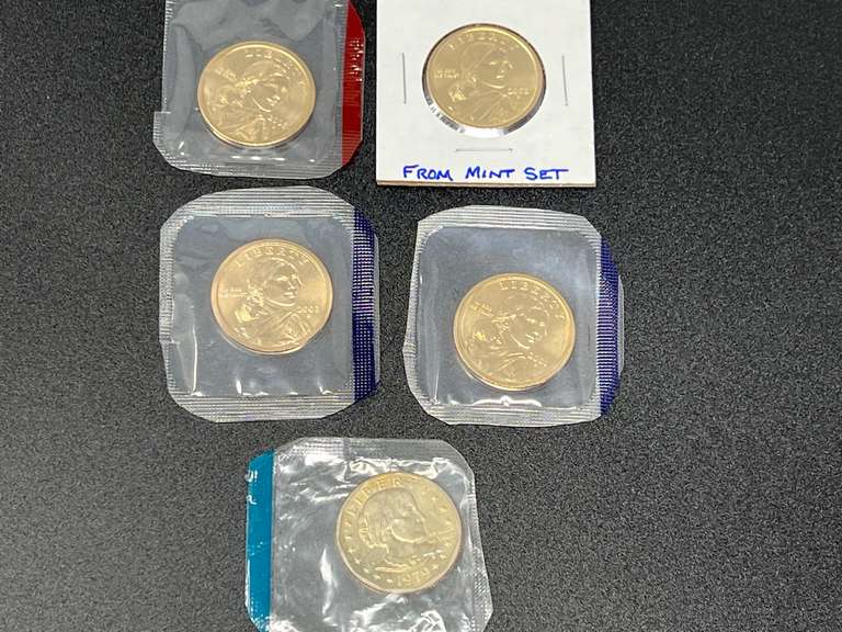 2001, 2002, and 2003 Sacajawea dollars, also includes a 1979 Susan B Anthony dollar, five pieces total, uncirculated, and from mint sets. See pictures or details. image