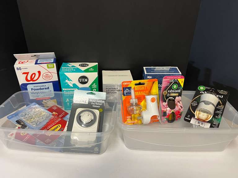 Assorted household items to include portable aromatherapy diffuser, Glade plug-in, Air Wick plug-in, powdered vinyl gloves, and more. Tubs are not included, see pictures for details. image