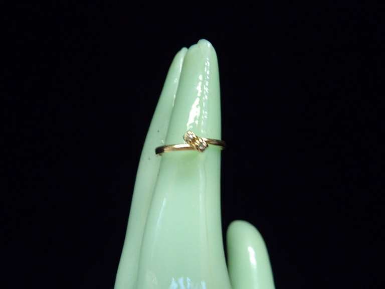 14 KARAT YELLOW GOLD RING SIZE 3 WEIGHING APPROX .7 GRAMS image
