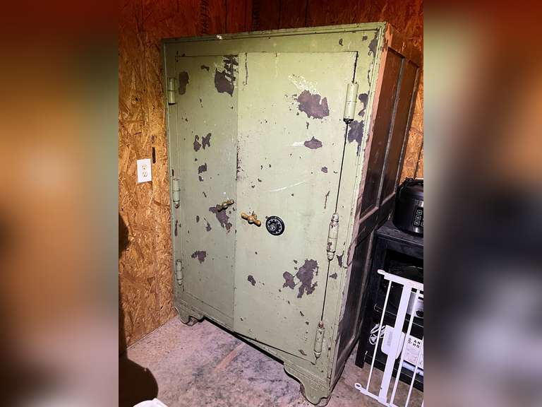 LARGE BANK SAFE. ON WHEELS. SELLER HAS COMBINATION AND DOES WORK. MEASUREMENTS 63 1/4 TALL-45 1/2 WIDE- 30 1/2 DEEP. THIS PIECE IS EXTREMELY HEAVY. image