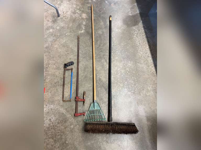 Pushbroom, small head rake, bar clamp and hacksaw, see pictures for details. image