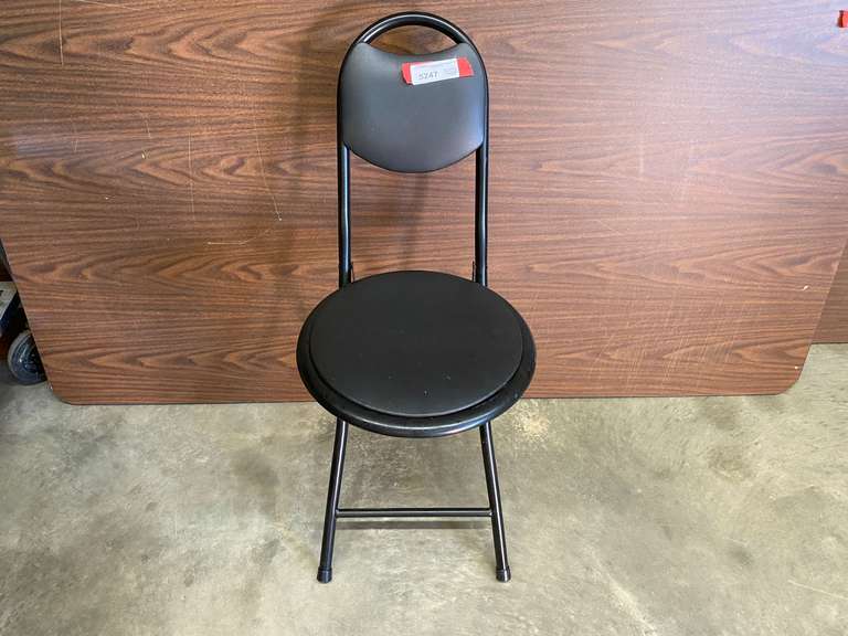 Black padded portable folding chair, see pictures for details. image