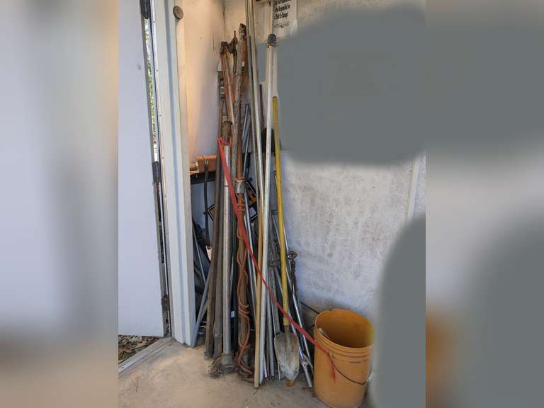 ALL ITEMS IN FRONT SHOP CORNER MARKED 1003 INCLUDING TELESCOPIC LIMB SAWS, TALL METAL SPUD DIGGING / CHISEL TOOLS, LEVEL, SPECIALTY SHOVEL, FIREPLACE TOOLS, AND MORE image