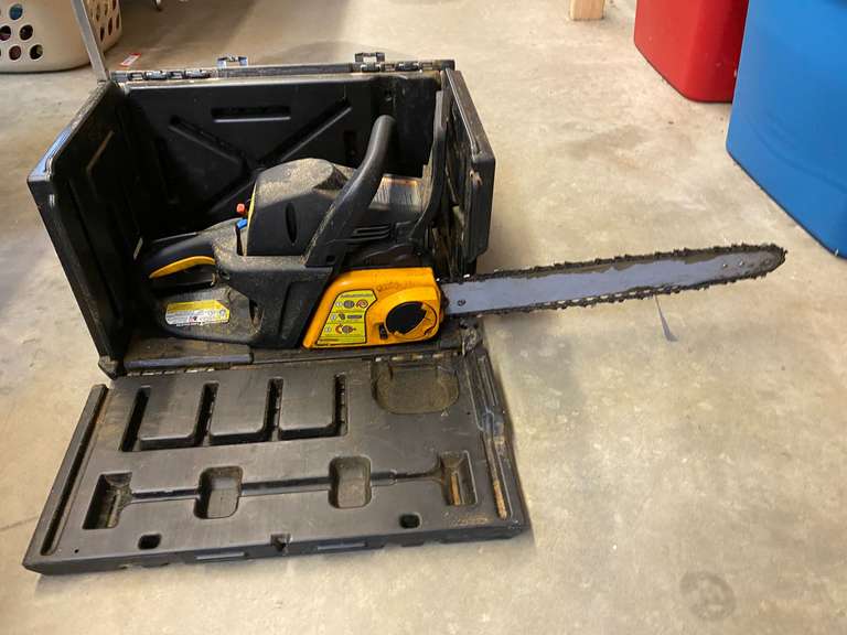 Chainsaw with carrying/storage case, believed to be a Poulan Pro, not locked up, see pictures for details. image