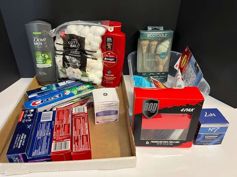 Assorted toiletries to include toothpaste, toothbrushes, body wash, cotton balls, and more. Tub is not included, see pictures or details. image