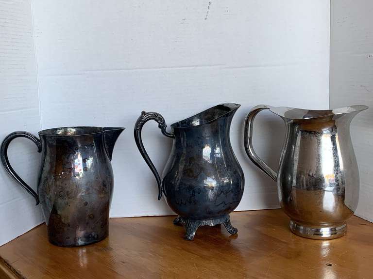 3 SILVER PLATE PITCHERS image