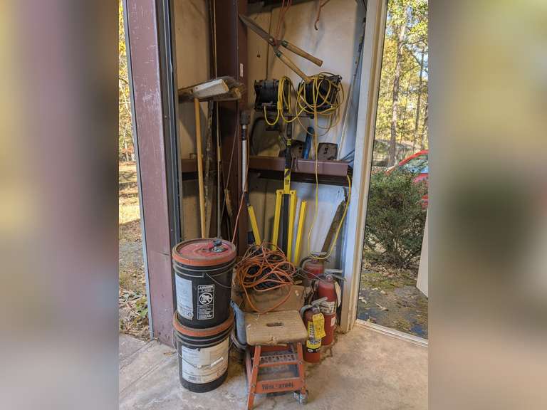 ALL ITEMS IN FRONT SHOP CORNER MARKED 1002 INCLUDING SUPER HEAVY DUTY DOUBLE HALOGEN TALL SHOP LIGHT, SAW, THREADED RODS, SHOP BROOMS, PARTIAL 5 GALLON DRUMS OF HYDRAULIC FLUID, FIRE EXTINGUISHERS, DROP CORD, AND MUCH MORE image