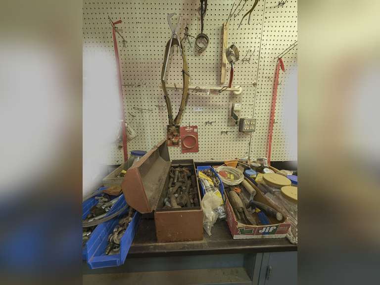 CONTENTS OF COUNTERTOP AREA AND HANGING ON PEGBOARD ABOVE MARKED 1038 INCLUDING LARGE FASTENERS, FASTENERS, TOOLS, TOOL BOX, COPPER TUBING, AND MORE image