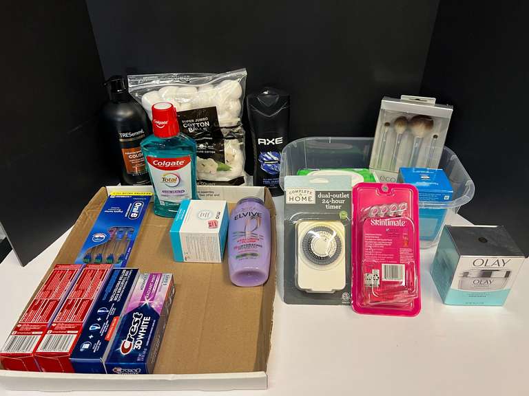 Assorted toiletries to include shampoo, Olay moisturizer, ladies razors, toothpaste, mouthwash, and more. Tub is not included, see pictures for details. ￼￼ image